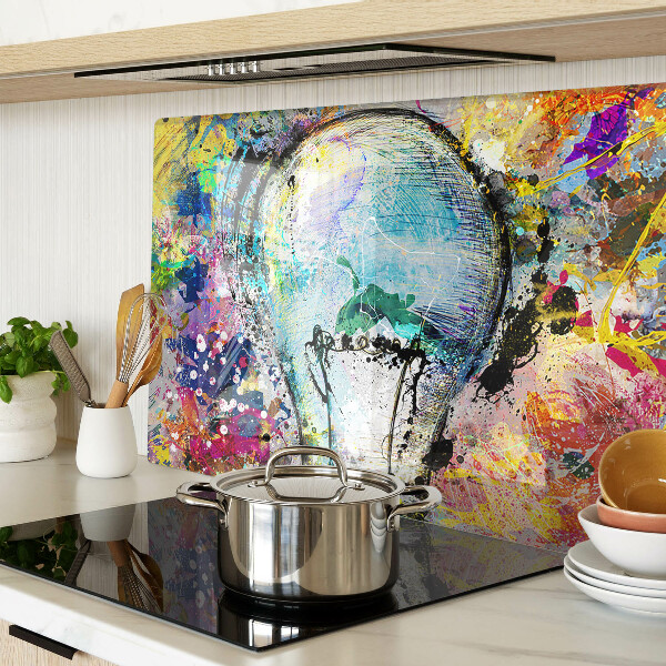 Snijplanken glas Gloeilamp op een gekleurde achtergrond