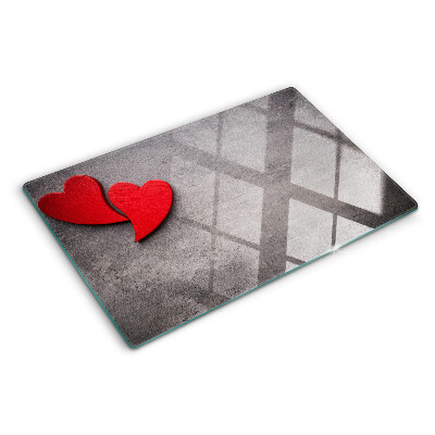 Snijplanken glas Een hart tegen de achtergrond van een raam.