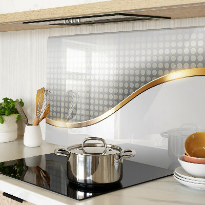 Glazen snijplanken Een gouden golf op een achtergrond van stippen.