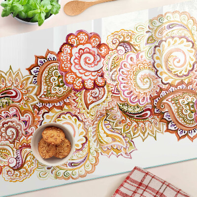 Snijplanken van glas Paisley-motief in tinten rood en goud.