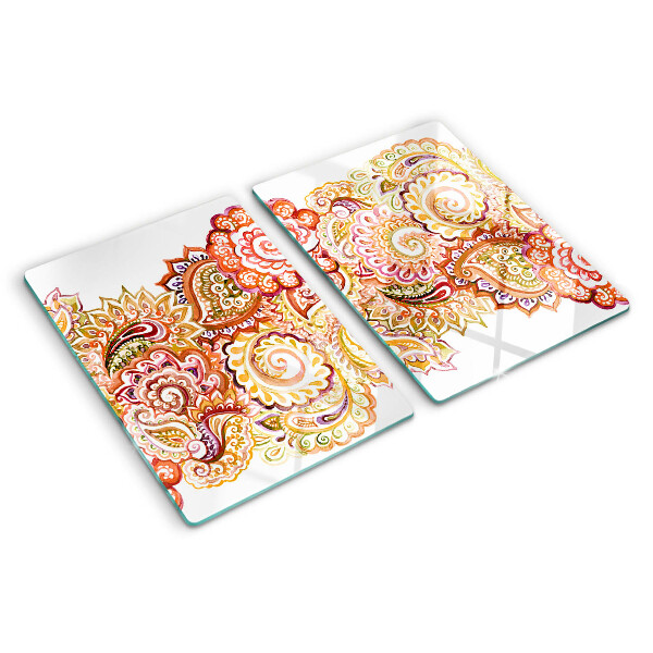 Snijplanken van glas Paisley-motief in tinten rood en goud.