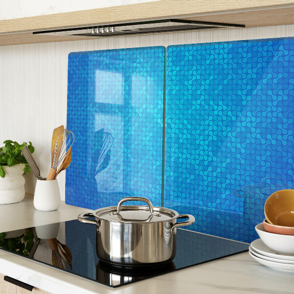 Snijplanken van glas Een golvend patroon in verschillende blauwtinten.