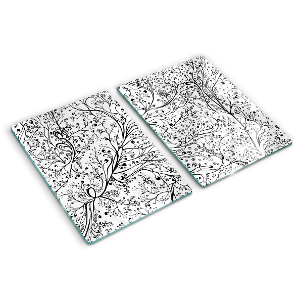 Snijplanken van glas Een plantenpatroon met delicate takken.