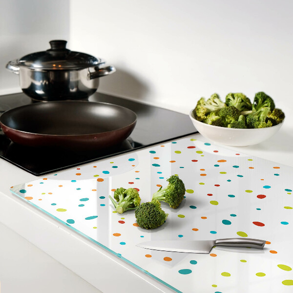 Snijplanken van glas Kleurrijke stippen op een witte achtergrond