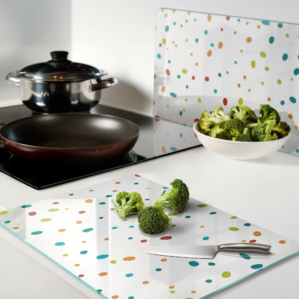 Snijplanken van glas Kleurrijke stippen op een witte achtergrond