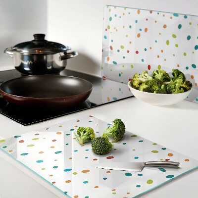 Snijplanken van glas Kleurrijke stippen op een witte achtergrond