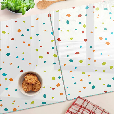 Snijplanken van glas Kleurrijke stippen op een witte achtergrond