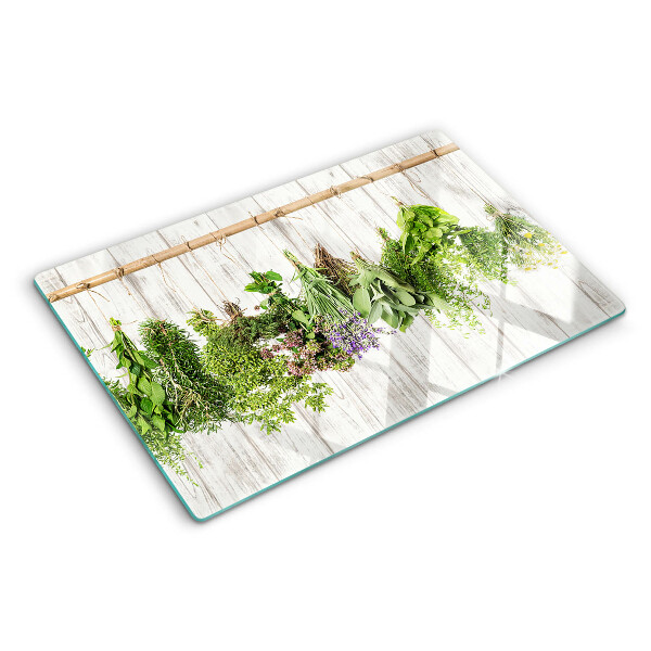 Snijplanken van glas Kruiden op een houten achtergrond