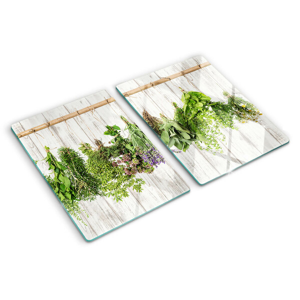 Snijplanken van glas Kruiden op een houten achtergrond