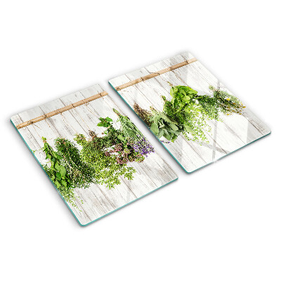 Snijplanken van glas Kruiden op een houten achtergrond