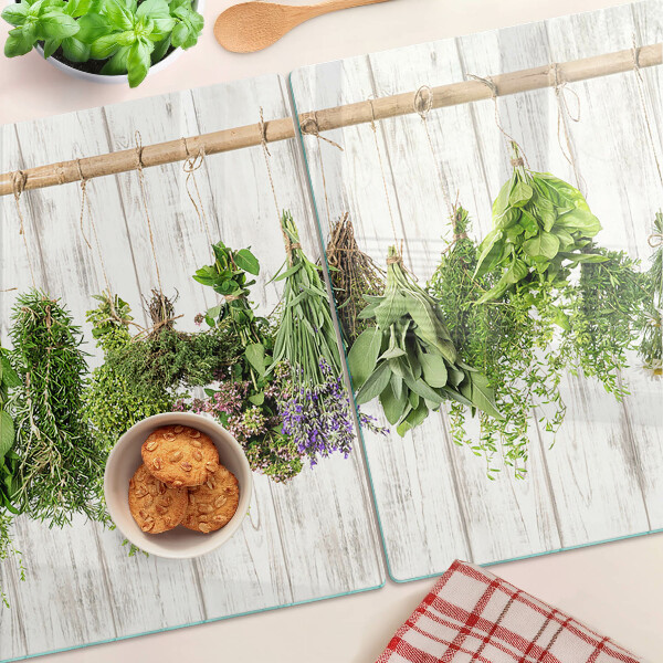Snijplanken van glas Kruiden op een houten achtergrond