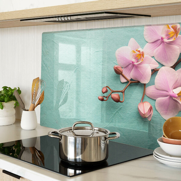 Snijplanken van glas Orchideeën op een blauwe achtergrond