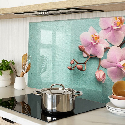 Snijplanken van glas Orchideeën op een blauwe achtergrond