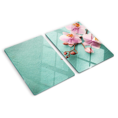 Snijplanken van glas Orchideeën op een blauwe achtergrond