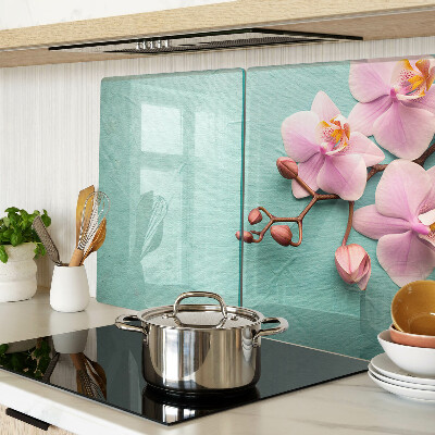 Snijplanken van glas Orchideeën op een blauwe achtergrond