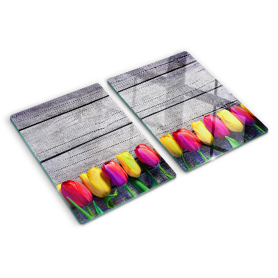 Glazen snijplanken Tulpen op een houten achtergrond