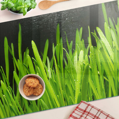 Snijplanken van glas Groen gras met waterdruppels