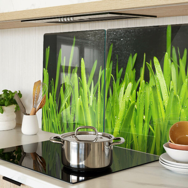 Snijplanken van glas Groen gras met waterdruppels