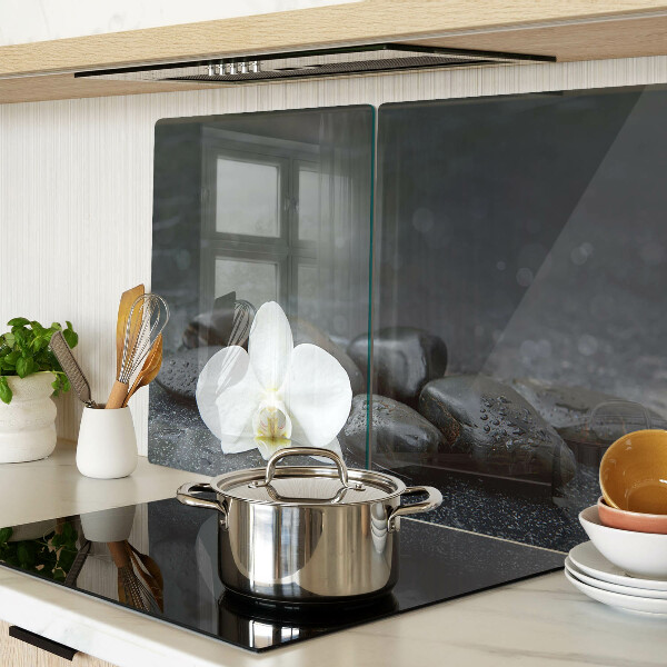 Snijplanken glas Orchideebloem op stenen