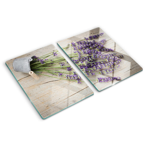 Snijplanken van glas Lavendel in een pot op een houten achtergrond