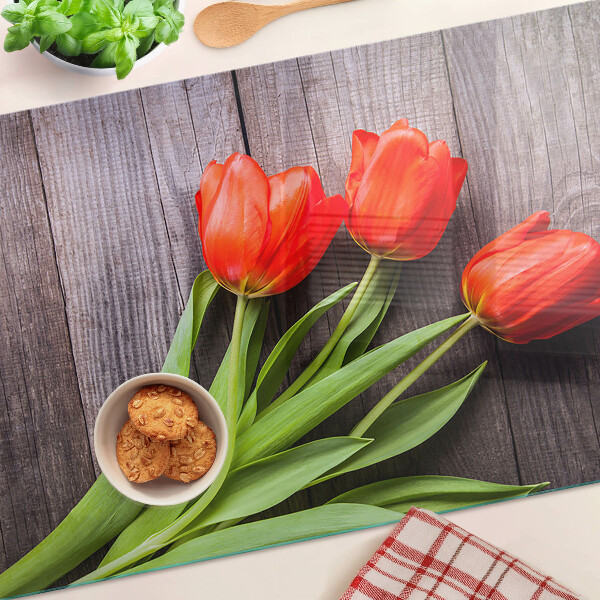 Glazen snijplanken Tulpen op een houten achtergrond
