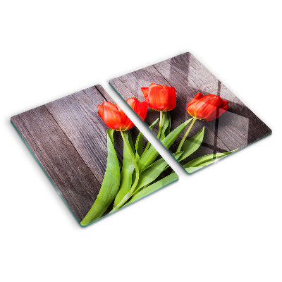 Glazen snijplanken Tulpen op een houten achtergrond