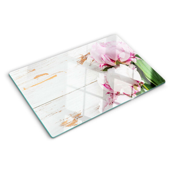 Snijplanken van glas Pioenrozen op een houten achtergrond