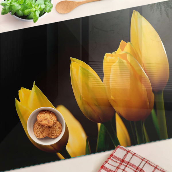 Snijplanken glas Gele tulpen op een zwarte achtergrond