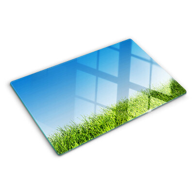 Snijplanken glas Groene weide onder een blauwe hemel