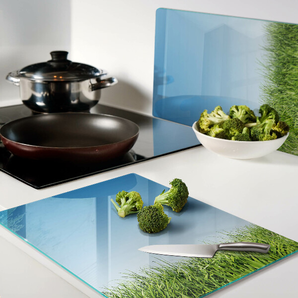 Snijplanken glas Groene weide onder een blauwe hemel