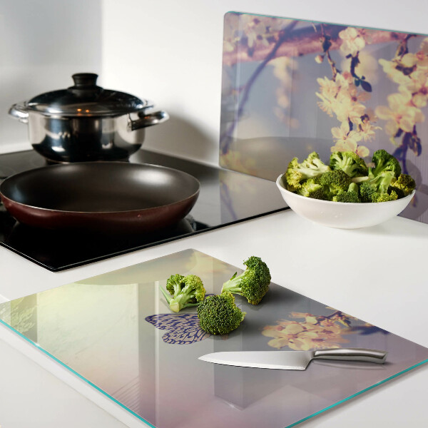 Glazen snijplanken Vlindermotief op een bloemenachtergrond