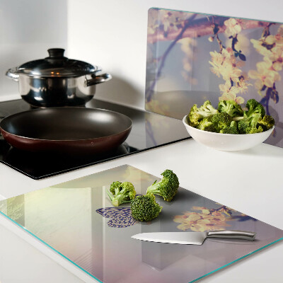 Glazen snijplanken Vlindermotief op een bloemenachtergrond