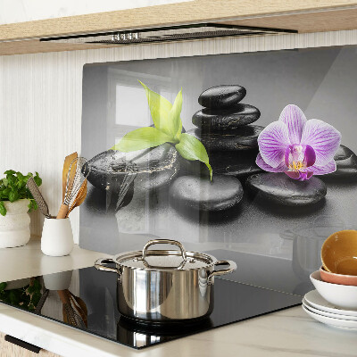 Glazen snijplanken Stenen en orchidee op de achtergrond