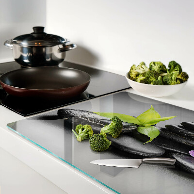 Glazen snijplanken Stenen en orchidee op de achtergrond