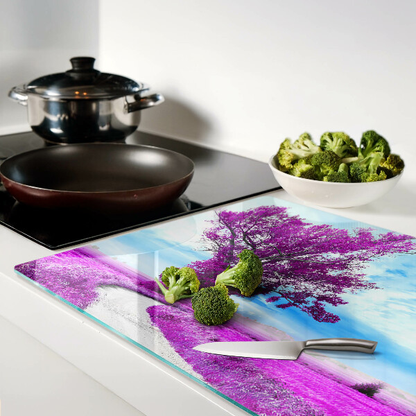 Snijplanken glas Een paarse boom tegen de hemel