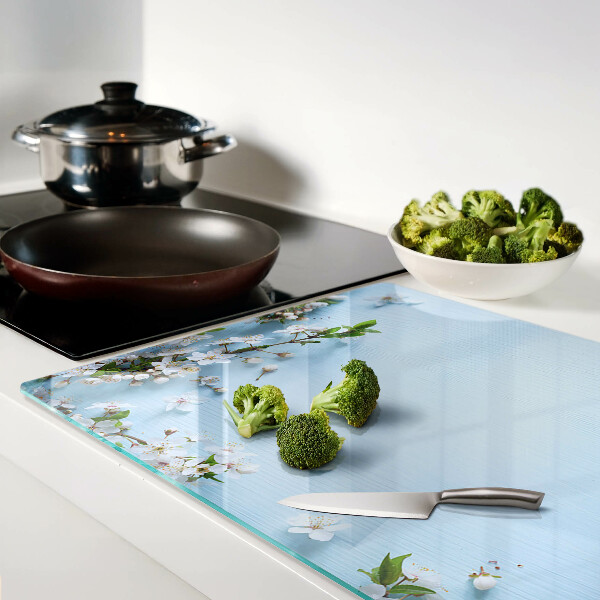 Snijplanken van glas Bloemenpatroon op een blauwe achtergrond