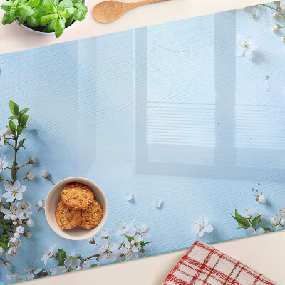 Snijplanken van glas Bloemenpatroon op een blauwe achtergrond