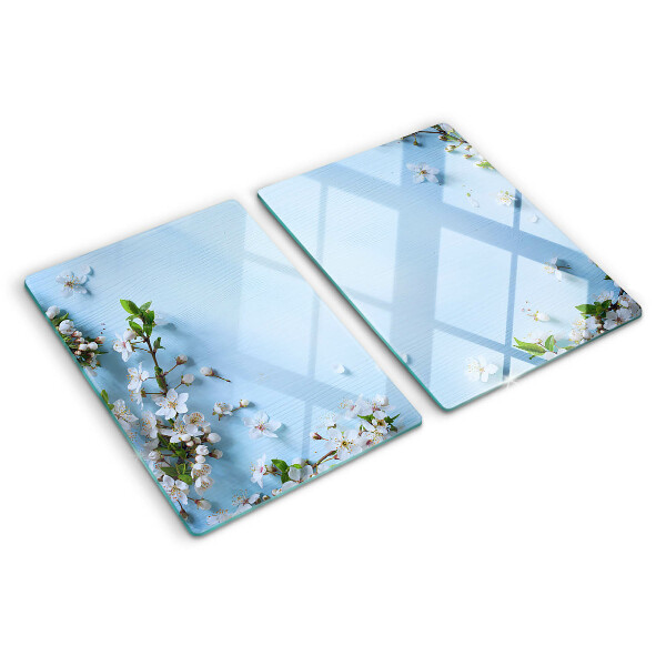 Snijplanken van glas Bloemenpatroon op een blauwe achtergrond