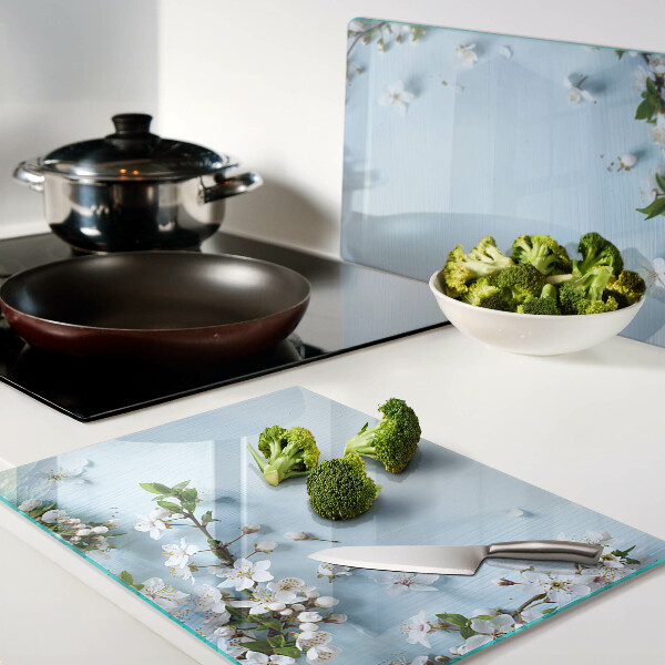 Snijplanken van glas Bloemenpatroon op een blauwe achtergrond