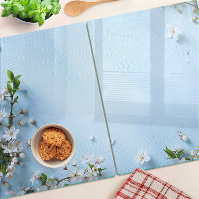 Snijplanken van glas Bloemenpatroon op een blauwe achtergrond