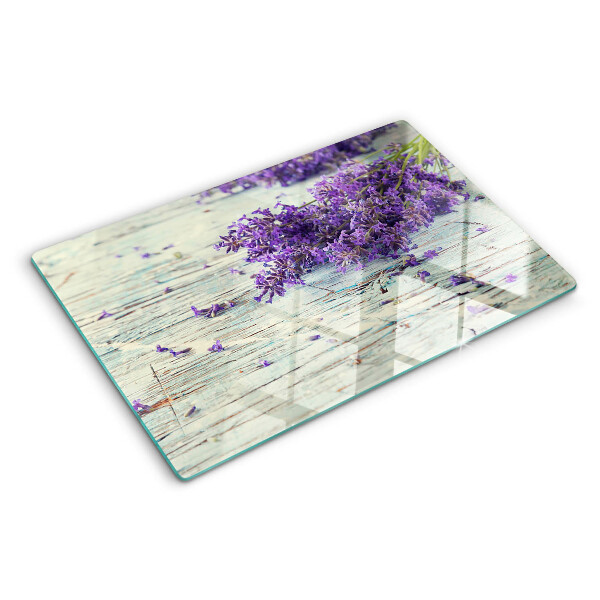 Snijplanken van glas Lavendel op een houten achtergrond
