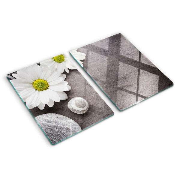 Glazen snijplanken Bloemen en stenen op de achtergrond