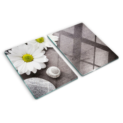 Glazen snijplanken Bloemen en stenen op de achtergrond