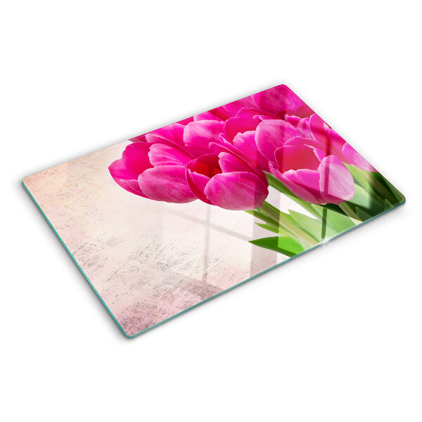 Glazen snijplanken Tulpenbloemen op een roze achtergrond