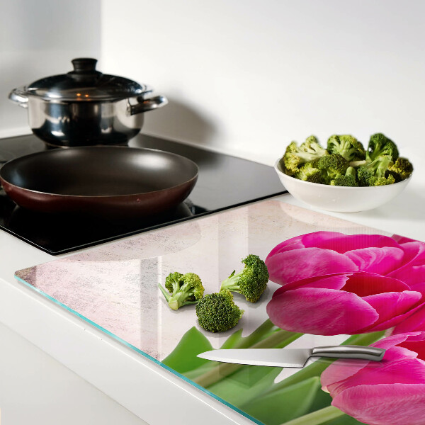 Glazen snijplanken Tulpenbloemen op een roze achtergrond