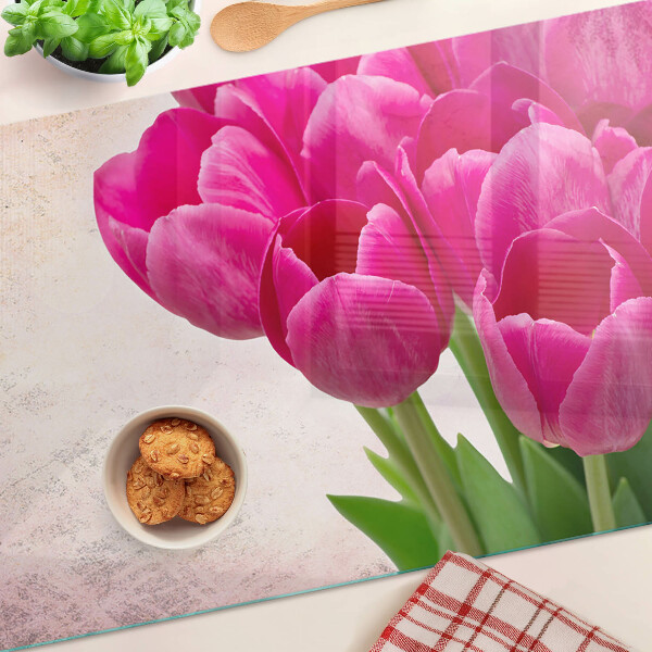 Glazen snijplanken Tulpenbloemen op een roze achtergrond