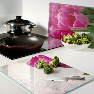 Glazen snijplanken Tulpenbloemen op een roze achtergrond