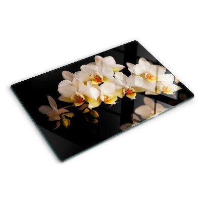 Snijplanken van glas Orchideeën op een zwarte achtergrond