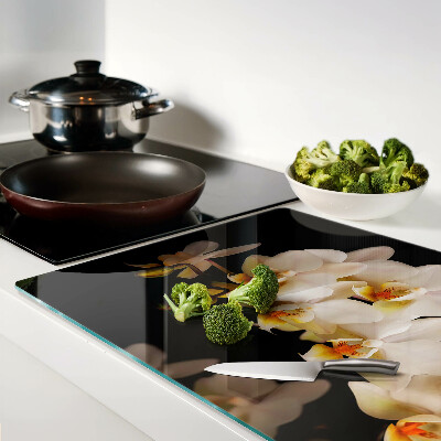 Snijplanken van glas Orchideeën op een zwarte achtergrond