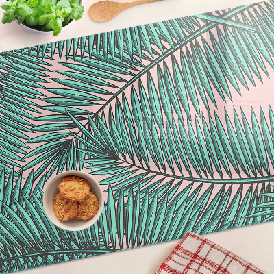 Snijplanken van glas Palmbladeren op een roze achtergrond